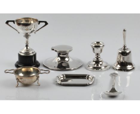 A collection of hallmarked silver, to include , a trophy on wooden plinth, a Liverpool Motor Club spoon, a tea strainer and b