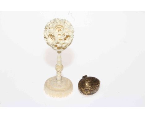 Ivory puzzle ball on stand and nut shaped thimble case (2).