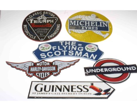 Six cast metal signs including Triumph Bonneville, Harley Davidson, Michelin Tyres, etc.