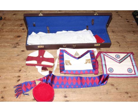 Large leather Masonic case, 99cm in length, Knights Templar tunics and hat, together with other Freemasonry aprons and a sash