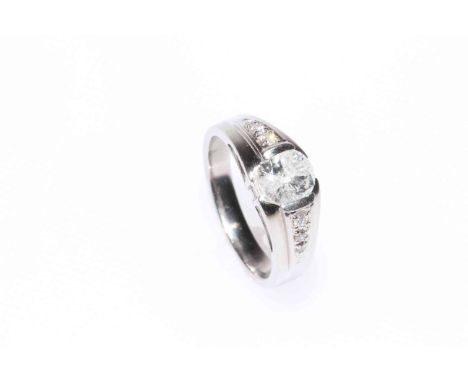 Platinum and diamond ladies ring with central diamond and three to each shoulder stamped 1.010ct, size L.