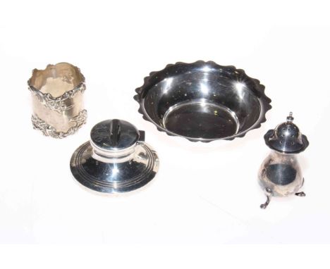 Four pieces of silver including inkwell, dish, napkin ring and cellar.