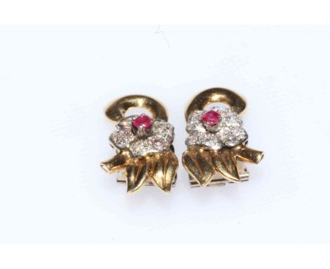 Pair of ruby and diamond clip on earrings.