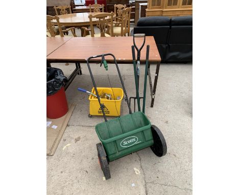 A GARDEN SPREADER, FORK, MOP BUCKET ETC 