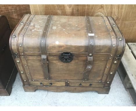 A WOODEN TRAVEL TRUNK (LOWER DRAW HANDLE MISSING) 