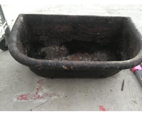 A VINTAGE CAST FEED TROUGH 
