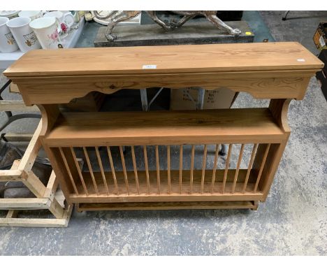 A WOODEN CABINET TOP WITH RACK AND SHELF 