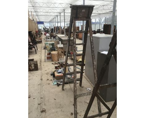 A SET OF VINTAGE SIX STEP WOODEN FOLDING LADDERS 
