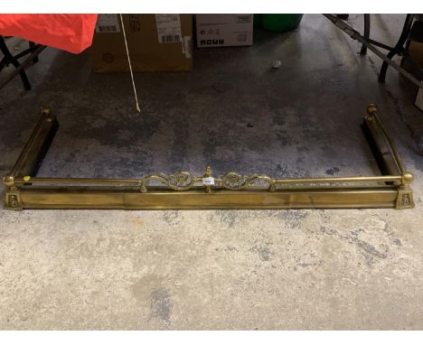 A BRASS FIRE PLACE FENDER 