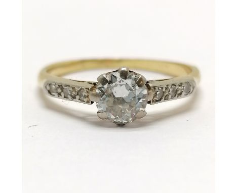 Unmarked 18ct gold diamond solitaire (4.6mm diameter) ring with diamond set shoulders (6) - size I½ &amp; 1.7g total weight ~