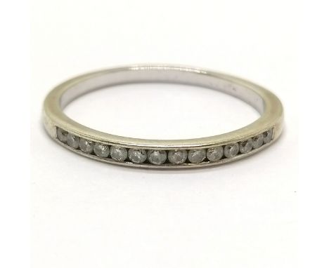Unmarked white gold half eternity ring channel set with 14 diamonds - size S &amp; 2g total weight 