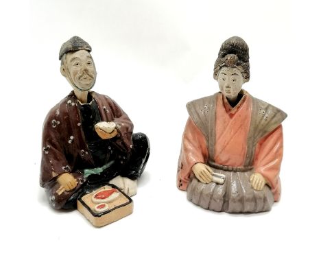 Pair of ceramic seated oriental nodding figures 18cm high - both have losses to the paint and male A/F to the head