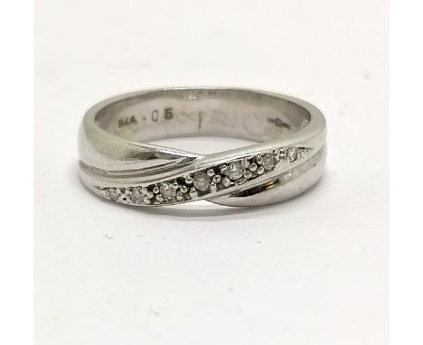 9ct hallmarked white gold crossover ring set with diamonds size J½ - 3g total weight - in overall good used condition 