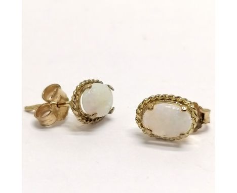 Pair of 9ct hallmarked gold cabochon opal stone set earrings - 1.2g total weight 