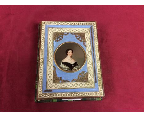 A Victorian decorative box, the lid inset with a miniature portrait and containing contents of various black and white photog