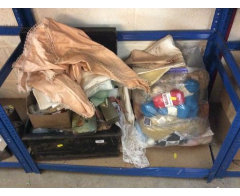 A large quantity of old fabric, wool, embroideries and a painted metal trunk