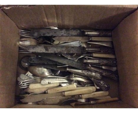 A collection of various vintage knives, forks and spoons