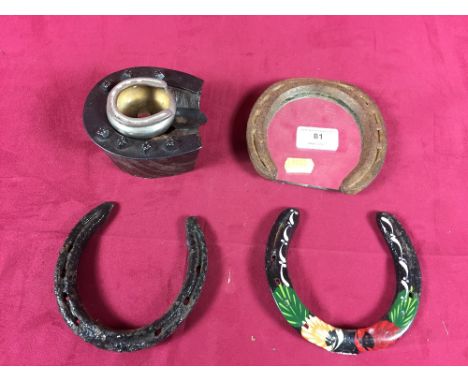 Two ashtrays in the form of horseshoes; a mirror with horseshoe frame and two other horseshoes