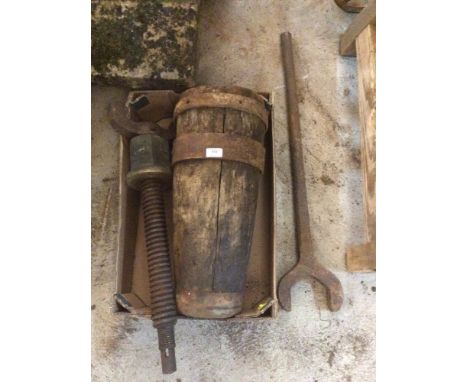A vintage cart or drum jack with spanner