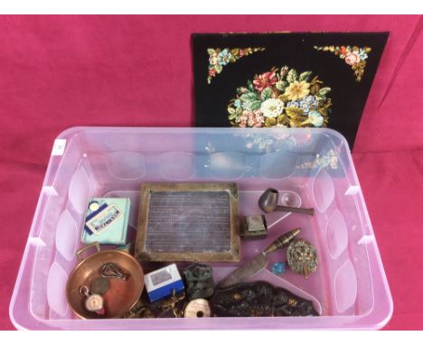 A box containing needlework panel; slate board; various brass handles; an ink well; brass plaque decorated with cherubs; East