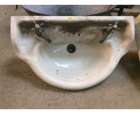 A vintage hand basin and taps