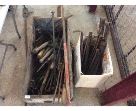 A wooden trunk and contents of numerous hand tools and a box containing various iron hinges