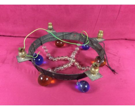 A four branch ceiling light fitting decorated with coloured glass balls