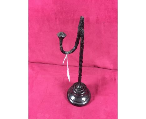 A mid 19th Century wrought iron table rush light on pottery base