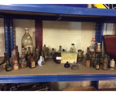 A collection of vintage bottles; spirit miniature bottles etc.