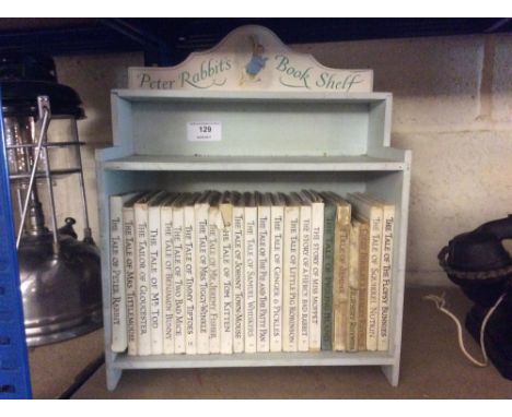 A quantity of Beatrix Potter books, on Peter Rabbit's book shelf