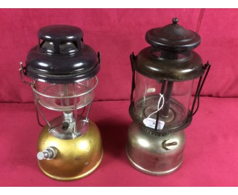 A tilley lamp and a Coleman lamp