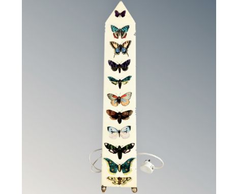 An Italian 20th century obelisk form metal table lamp decorated with butterflies, designed by Piero Fornasetti, labeled Forna