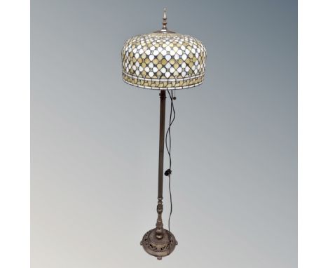 A contemporary Art Deco style standard lamp with leaded glass shade  CONDITION REPORT: In good condition and in working order