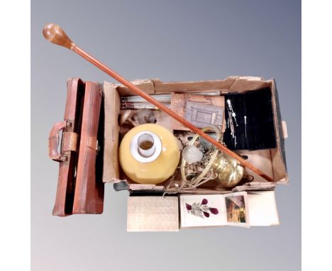 A vintage leather briefcase of sheet music, brass electric hanging oil lamp with chimney & shade, an illustrated volume Charl