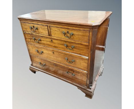 A George III mahogany five drawer chest on bracket feet (damages)