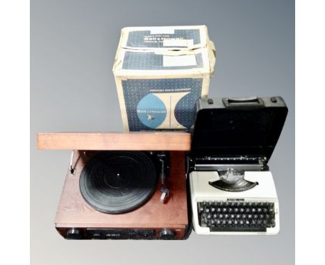 A retro style music centre, A Bell & Howell projector and a Brother 210 typewriter 