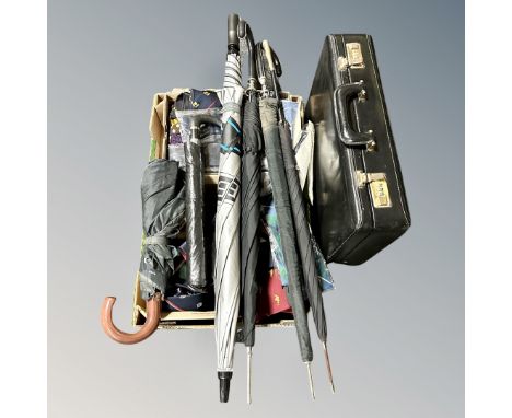 A leather combination briefcase, five umbrellas and a box of assorted ties