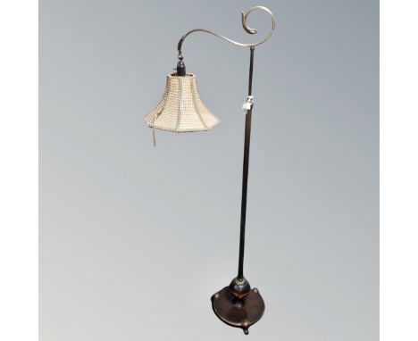 A 1930's brass rise and fall reading lamp (continental wiring) 