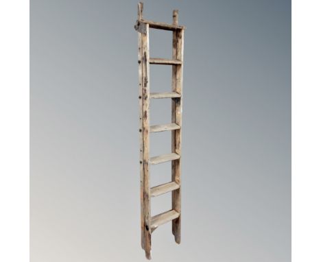 A vintage wooden folding multi purpose ladder 