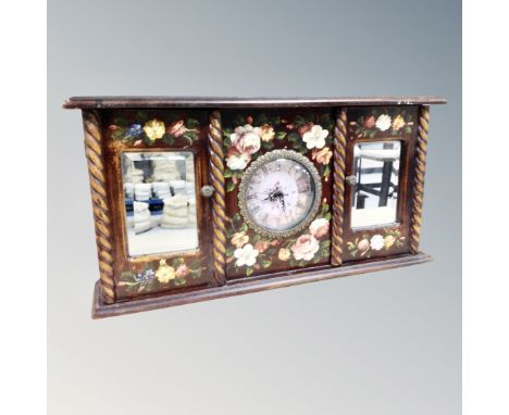 A contemporary Quartz mantel clock with two mirrored doors 