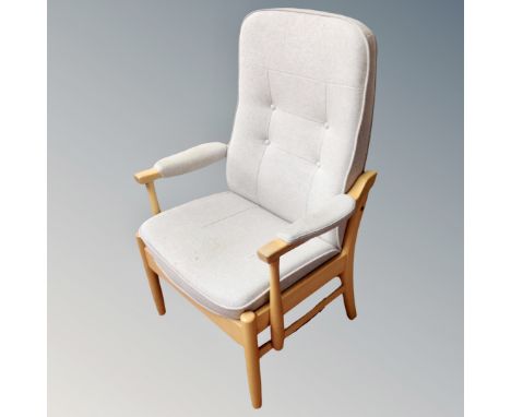 A Farstrub Mobler wood framed reclining armchair in grey button fabric 