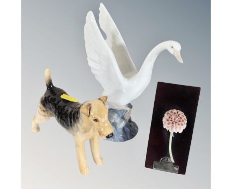 A Nao swan, Beswick terrier and a Lladro Dahlia flower mounted on plinth 