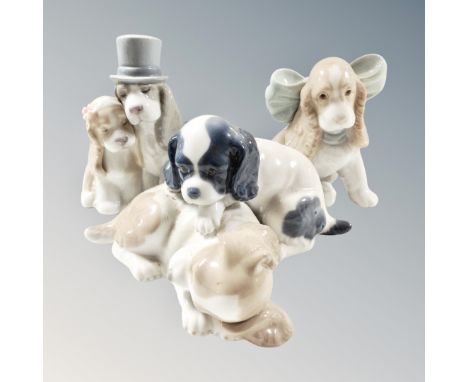 Three Nao dog figures 