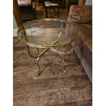 Jensen Style brass and glass coffee table the circular top raised on hoof feet 65cm diameter x 65cm