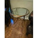 Jensen Style brass and glass coffee table the circular top raised on hoof feet 65cm diameter x 65cm