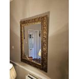 Accent mirror ornately carved gilt mirror, featuring a richly detailed frame 87 x 117cm