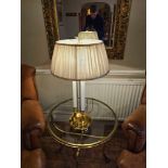 A polished brass Directoire Bouillotte lamp with three lights and linen shade 67cm tall