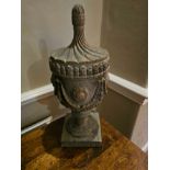 A pair of reproduction 18th-century Coade urns composite 45cm tall