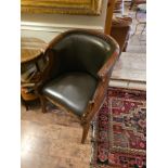 A Fauteuil In French Empire Style. The Moulded Curved Top rails Above Padded And Scooped Backs