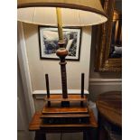 A table lamp in the form of a Victorian wood screw book press. Constructed of distressed walnut